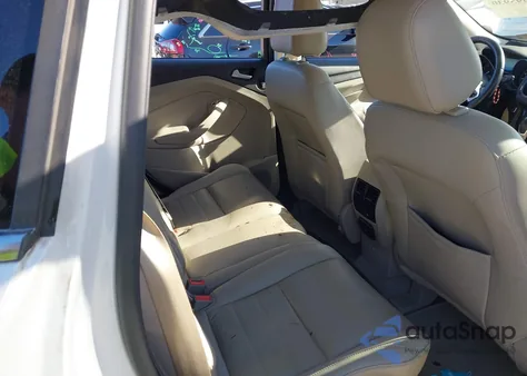 2015 Ford Escape Titanium z USA, uszkodzony, nr VIN 1FMCU9J98FUB79114